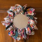 This embroidery hoop upcycled wreath is easy to make with old flannel shirts that you may have on hand or can buy at your local thrift store.
