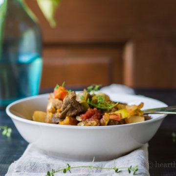 This harvest vegetable beef stew recipe is so delicious. Made in a slow cooker, it's a great way to use up a ton a fresh vegetables with very little work.