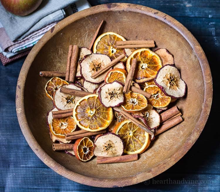 Homemade potpourri made with natural apples, orange slices and cinnamon sticks.