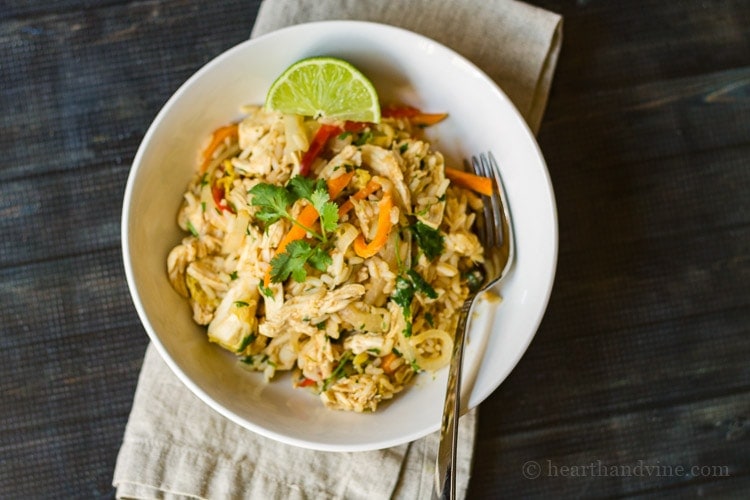 This burrito bowl recipe has wonderful thai flavors that you can easily make at home, with chicken, cilantro and fresh lime, for a tasty dish.