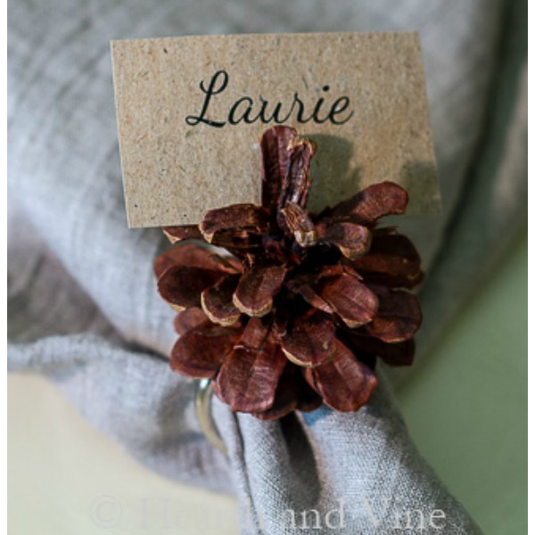 Pinecone napkin ring with the name tag Laurie.