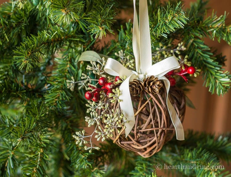 Kissing ball ornament with ribbon hanger.