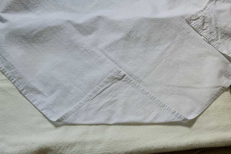 Top corners of tea towel folder over.