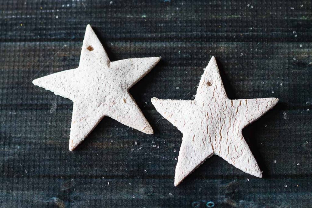 Salt dough stars with white paint and glitter