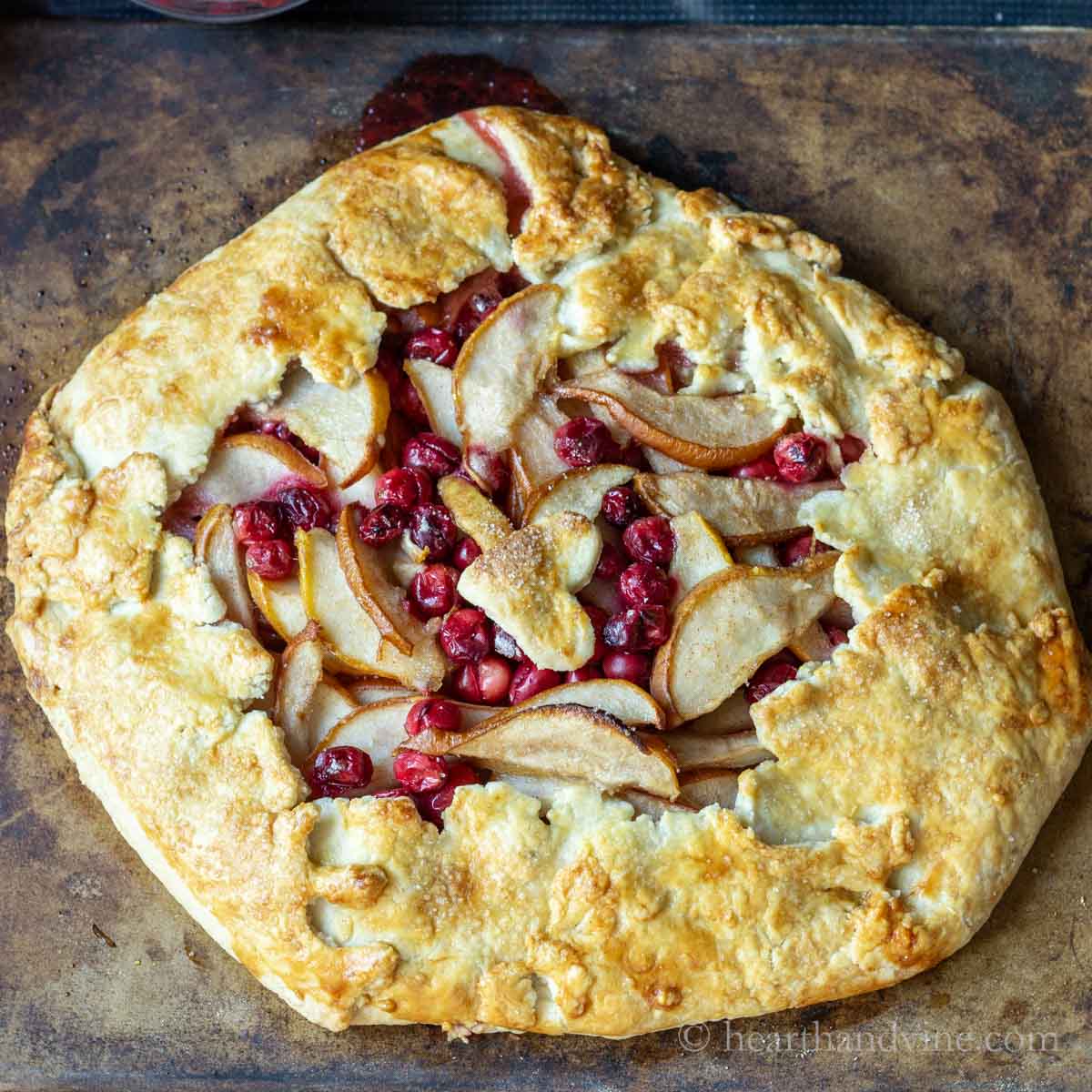 Cranberry pear galette on a baking stone.