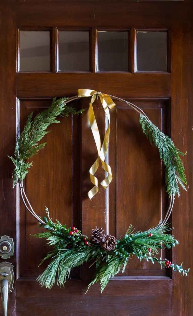 Natural Christmas wreath complete with gold ribbon.