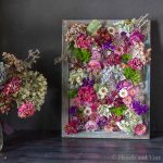 Framed dried flowers with canvas frame and wire.