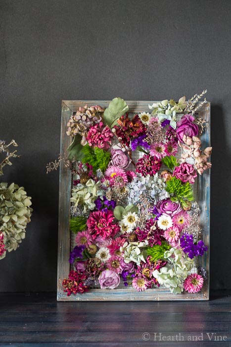 Framed dried flowers on a wooden frame
