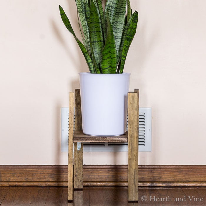 Modern plant stand with potted plant