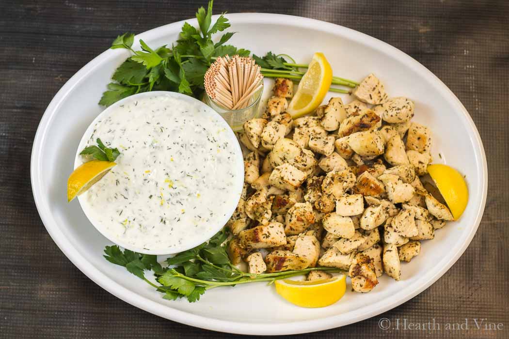 Platter of Greek chicken bites and Tzatkiki sauce.