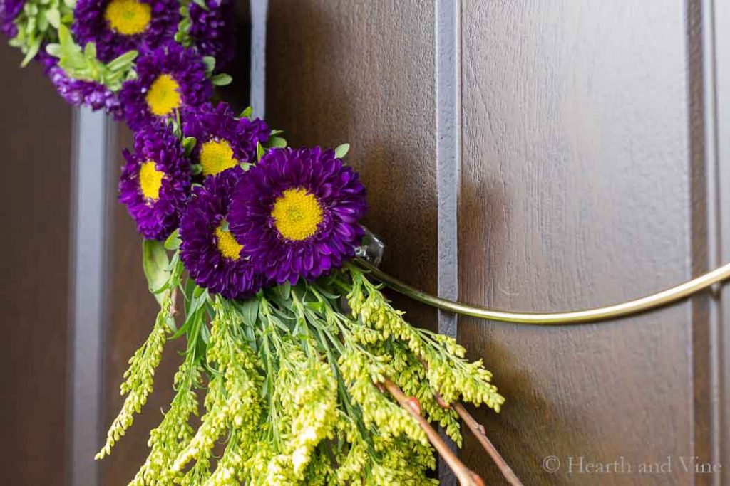 Modern spring wreath held into place with command hook.