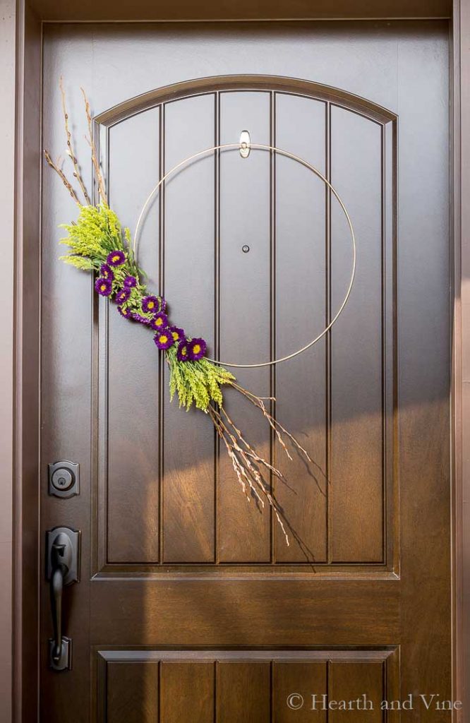 Entry door with modern spring wreath