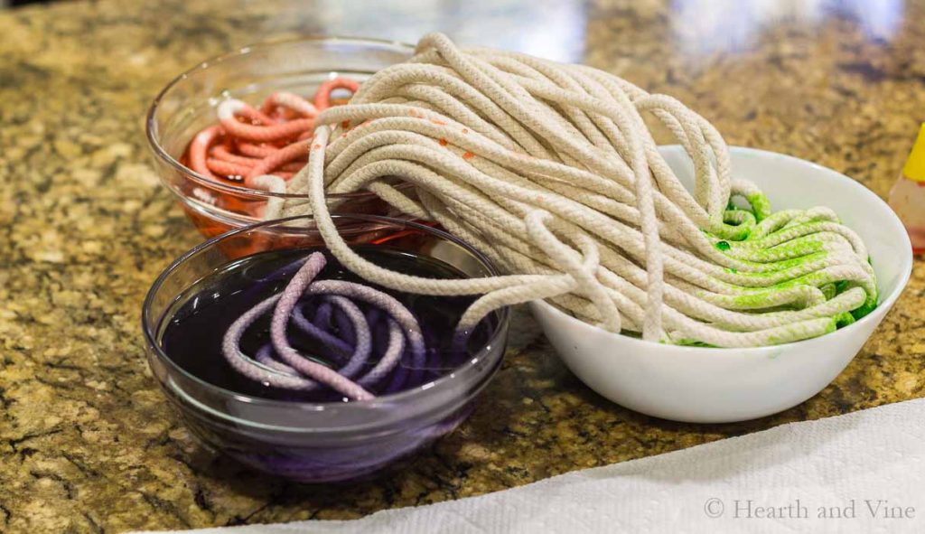 Clothesline rope dying in three bowls.