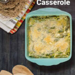 Cheesy asparagus casserole in a blue baking dish.