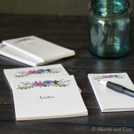 custom DIY notepads on table with pen