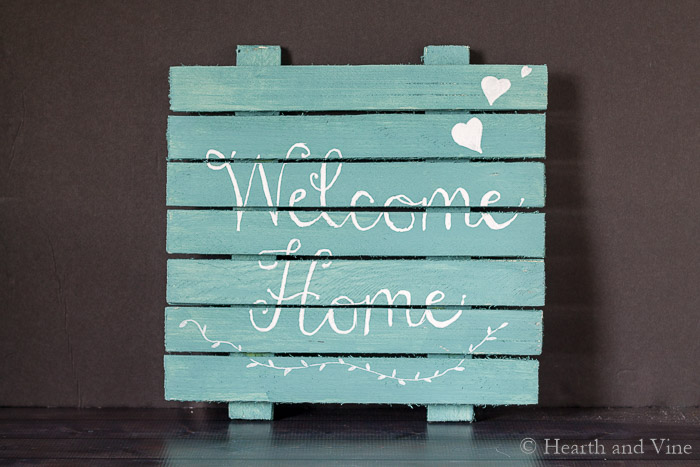 wooden sign with welcome home statement