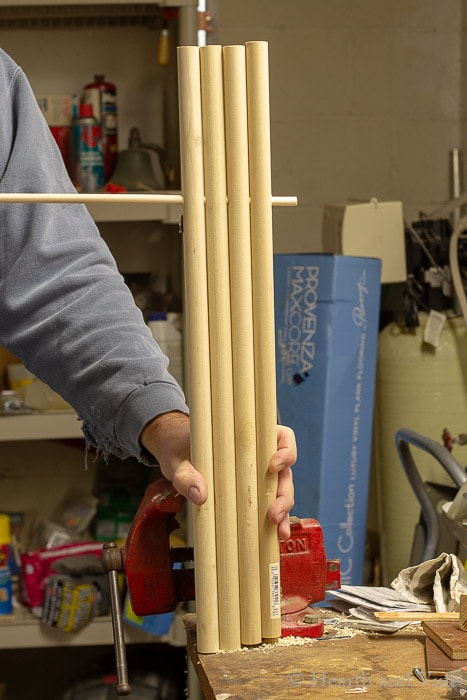 Four wooden dowels and one thinner one to help straighten out the legs.