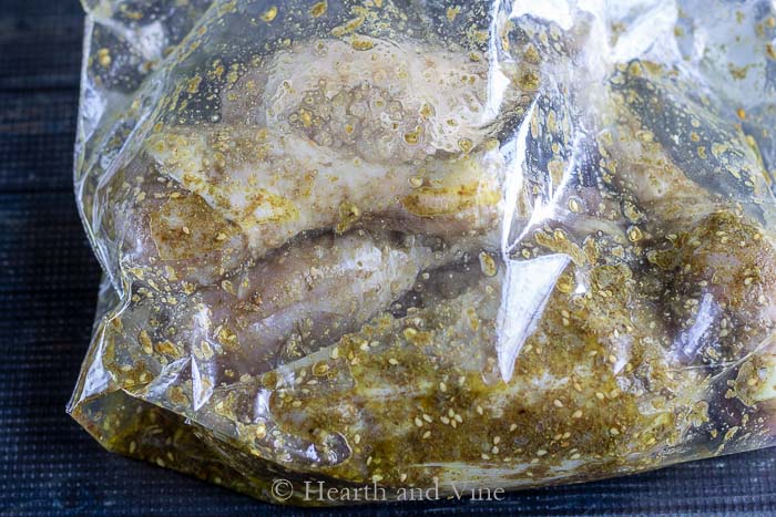 Zaatar chicken marinating in a bag
