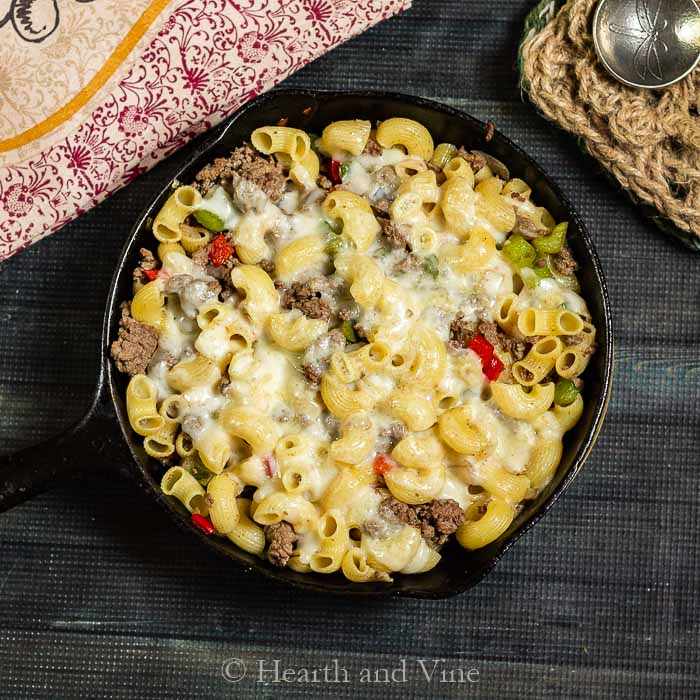 philly cheese steak pasta recipe in a cast iron skillet