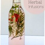 bottle of herbal vinegar with sprigs of herbs inside