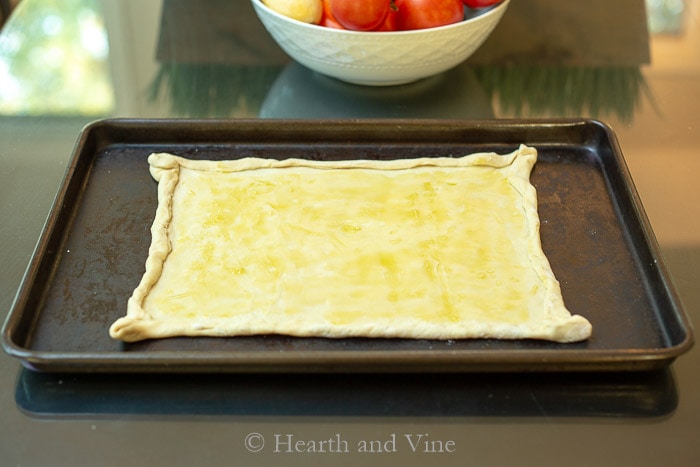 Puff pastry dough brushed with garlic oil.