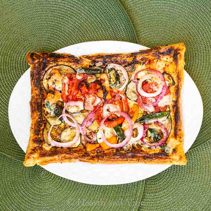 Grilled vegetable tart on tray.