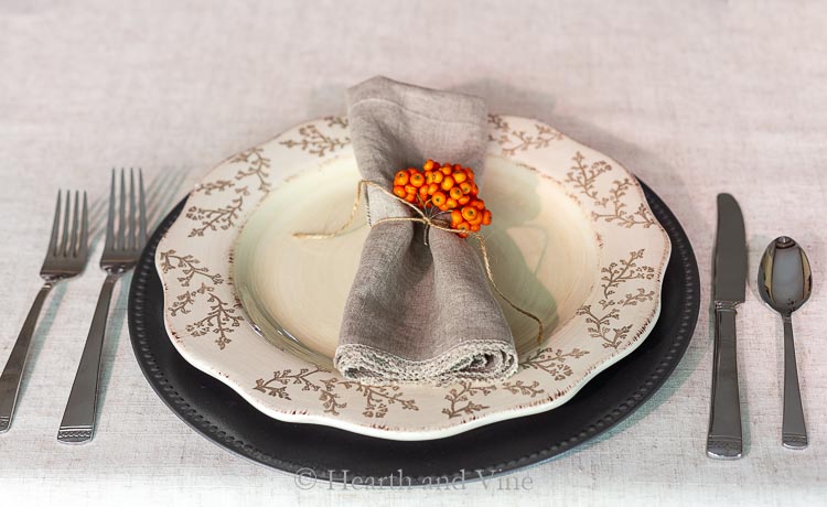 Fall table setting with pyracantha berries