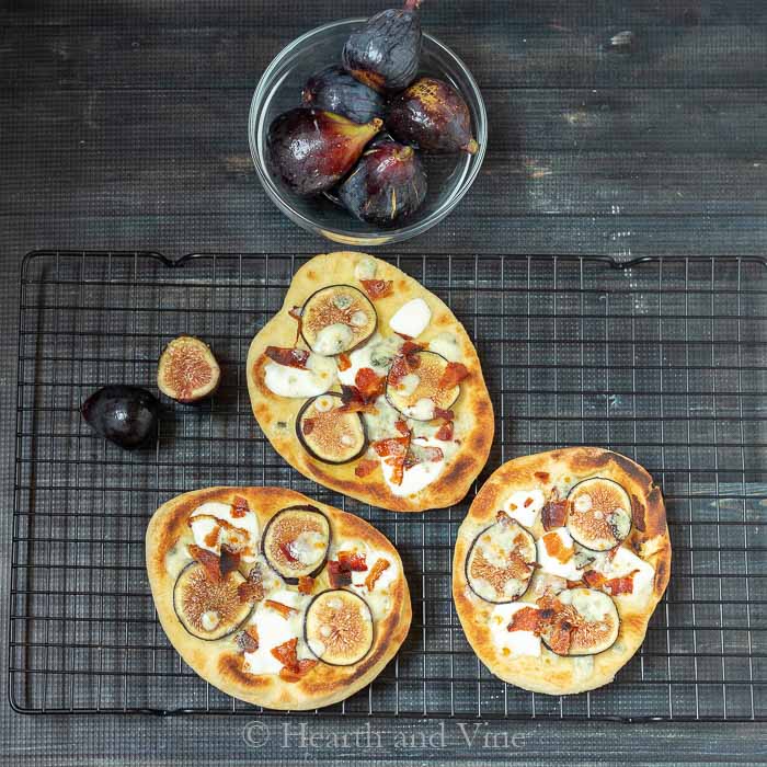 trio of fig bacon and gorgonzola pizza.