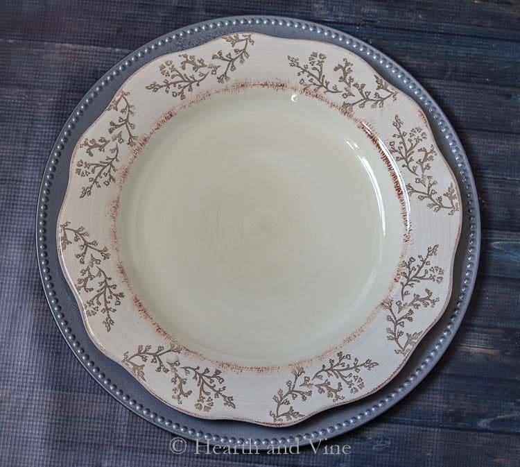 Faux galvanized charger plate under dinner plate