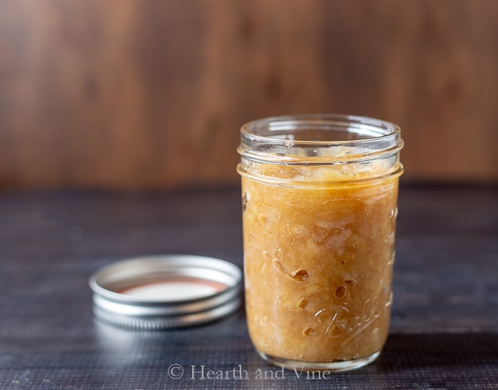Applesauce in jar with room at top.