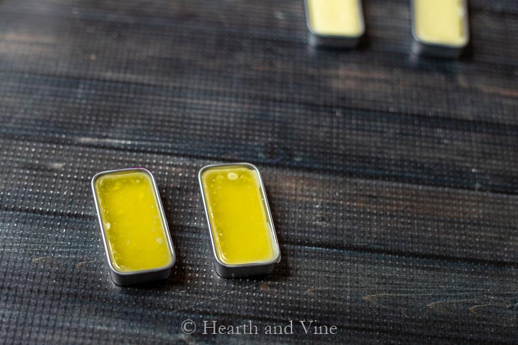 Solid perfume poured into tins