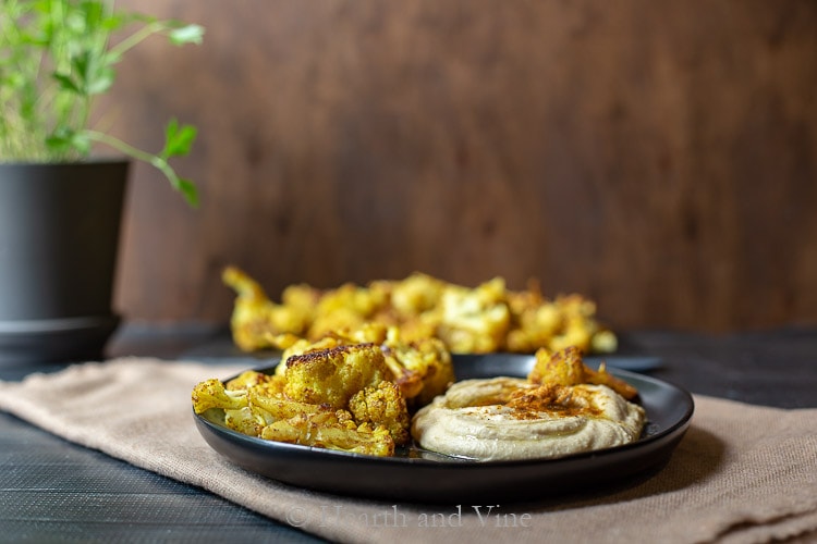 Dish with spicy roasted cauliflower and hummus