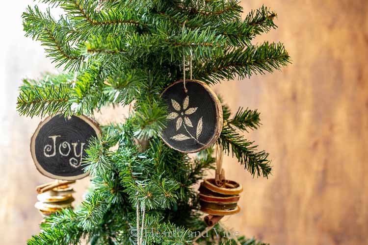 Wood slice ornaments on tree.