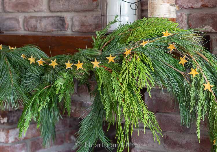 Natural lemon peel star garland on right side of mantel