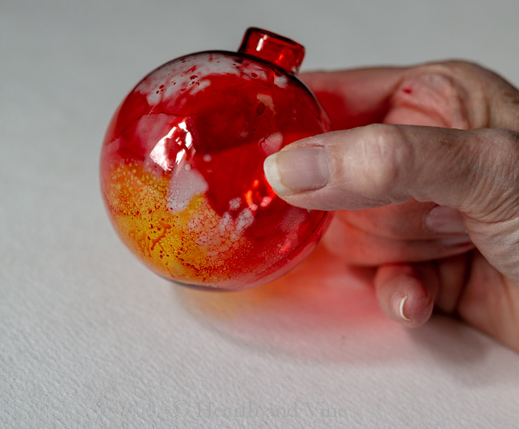 Red and yellow alcohol ink ornament