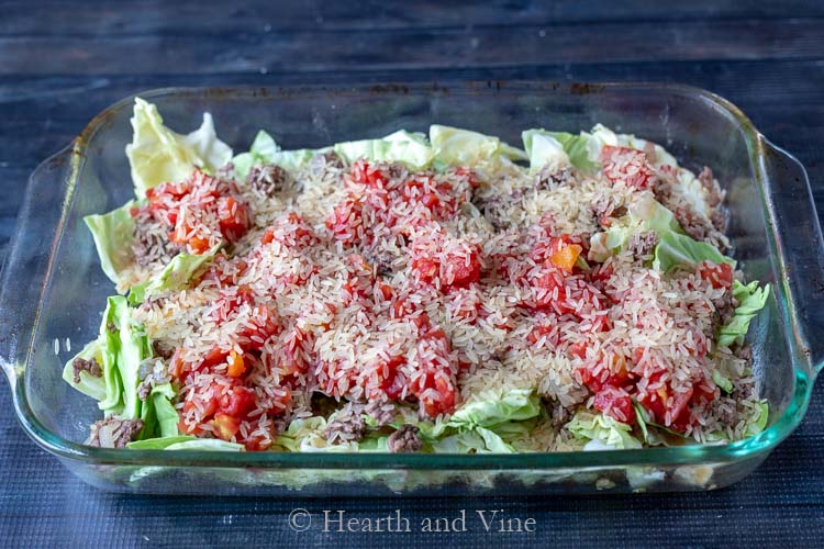 Second layer of casserole with tomatoes, beef and rice