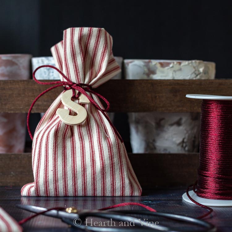 Christmas treat bag decorated with wooden initial