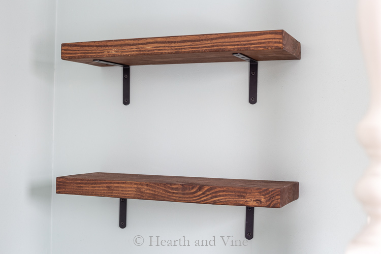 Two wood shelves on wall