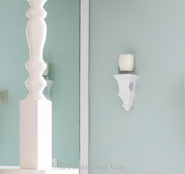Wall sconce with candle