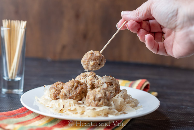 Pork and sauerkraut balls hand