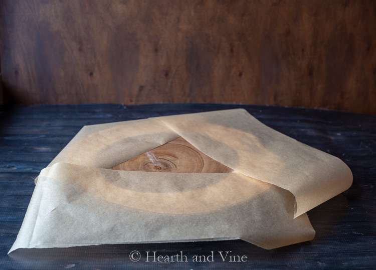 wood slice tray covered with parchment paper