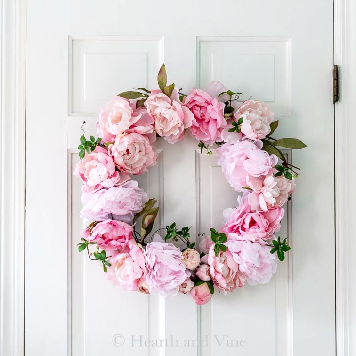 spring peony grapevine wreath on white door