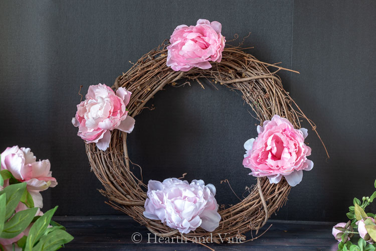 Four peonies on grapevine wreath