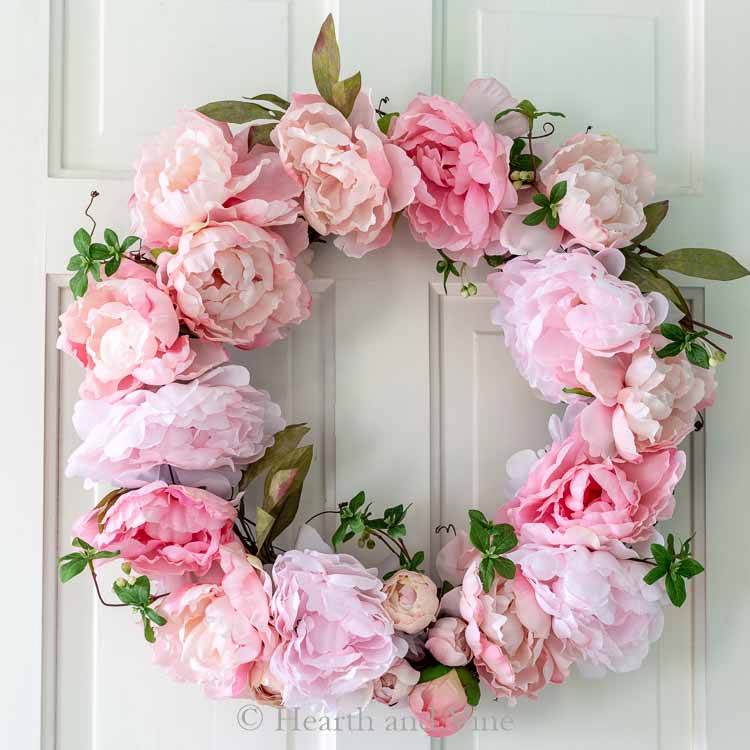 DIY spring peony wreath on white door