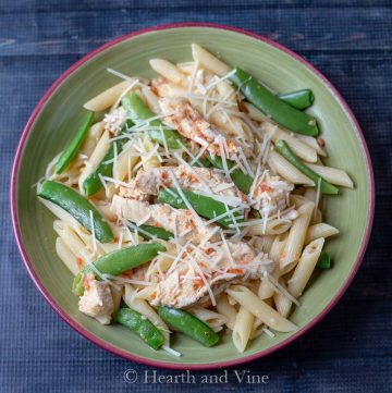 Creamy red pepper sauce pasta with chicken and snap peas