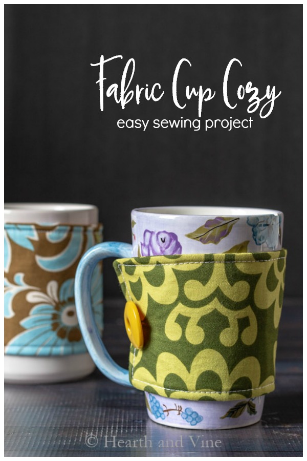 Fabric coffee sleeve on a floral tall coffee cup and another in the background on a white mug.