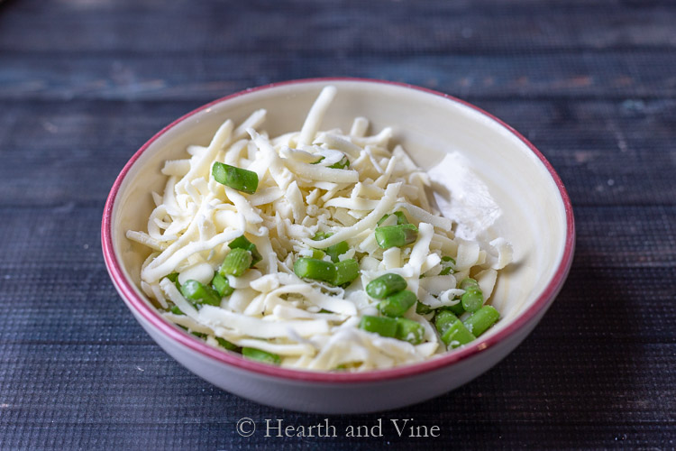 Asparagus and cheese in bowl