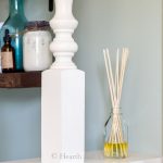 Homemade reed diffuser on shelf.