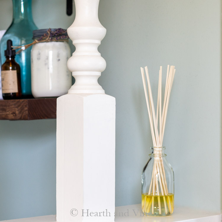Homemade reed diffuser on shelf.