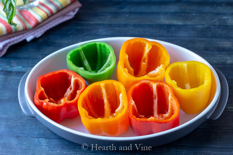 Sweet bell peppers in green orange yellow and red